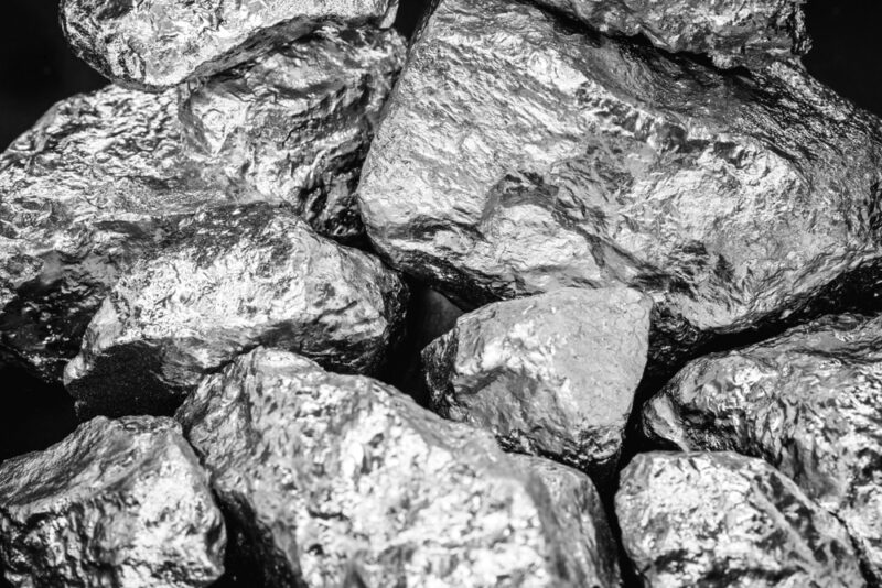 Pieces of palladium on a black background.